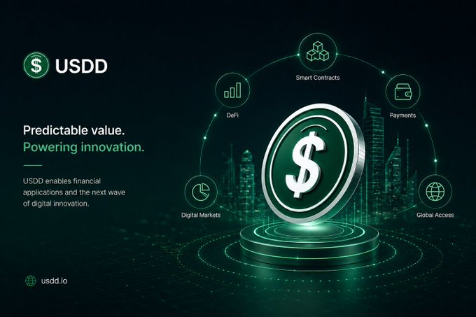 A promotional graphic for USDD featuring a large silver dollar coin on a glowing green pedestal, surrounded by icons representing Smart Contracts, Payments, Global Access, Digital Markets, and DeFi, with the tagline "Predictable value. Powering innovation." and the website usdd.io displayed against a dark futuristic cityscape backdrop.