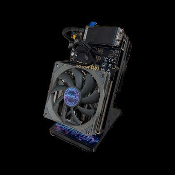 A compact computer/Mining rig featuring a motherboard with a cooling fan, set against a black background.