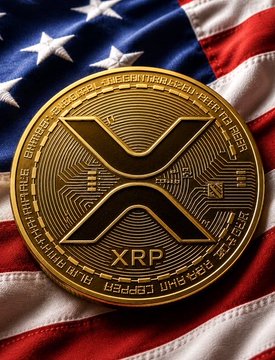 A gold XRP coin rests on an American flag, symbolizing the cryptocurrency's response to the U.S. Treasury's potential expansion of debt buybacks beyond $4 billion, which could inject more liquidity into markets that crypto investors are closely monitoring.