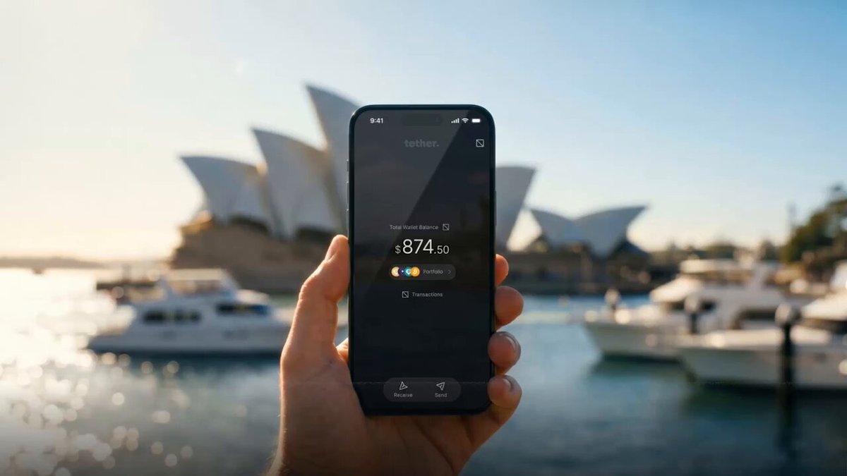 The image shows a person holding up their phone displaying the time of 9:44 PM. The background features a beautiful view of boats near a harbor, with a large building visible in the distance. The text in the image reads "From Emerging Markets to Global Finance Tether Wallet now with Tether Wallet, they have direct access to digital dollars, Bitcoin, and gold, without needing a bank account".