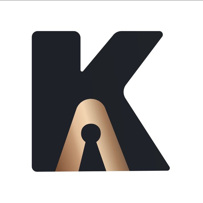 A stylized logo featuring a large black letter "K" with a golden keyhole design in the center on a white background.