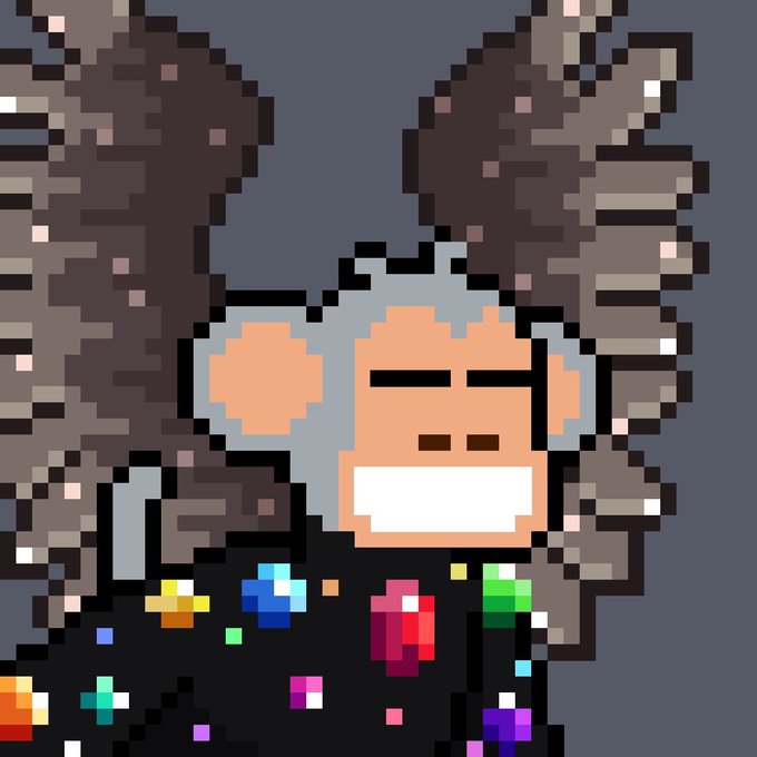 A pixel art portrait of an ape-like character with gray hair, a wide white grin, and a black shirt covered in colorful pixelated gems, set against a dark gray background.