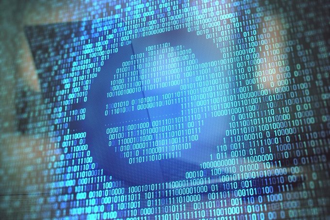 A hooded figure is overlaid with cascading streams of binary code (0s and 1s) in blue and white, evoking themes of digital surveillance, hacking, and data manipulation. This imagery visually reinforces the post's claims about the "digital euro," suggesting hidden control, cyber manipulation, and the influence of payment giants like Visa and Mastercard behind the push for a centralized digital currency.