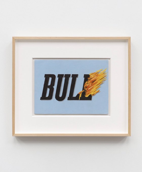 A framed artwork on a white wall displays the word "BULL" in bold black letters against a light blue background, with the final letter engulfed in painted flames. The fiery imagery visually conveys the bullish market sentiment suggested by the accompanying "BULL" post.