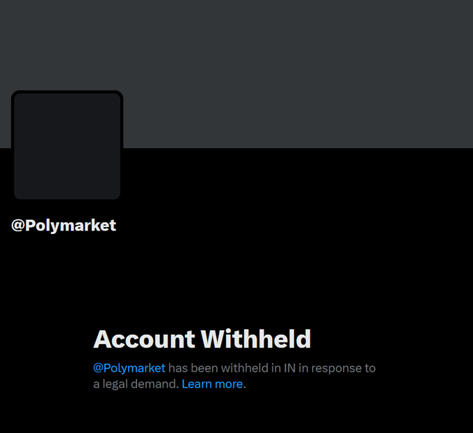 A screenshot of a Polymarket notice shows “@Polymarket has been withheld in IN in response to a legal demand. Learn more.” Under the headline “Account Withheld,” it relates to the breaking report that Polymarket’s X account is withheld in India.