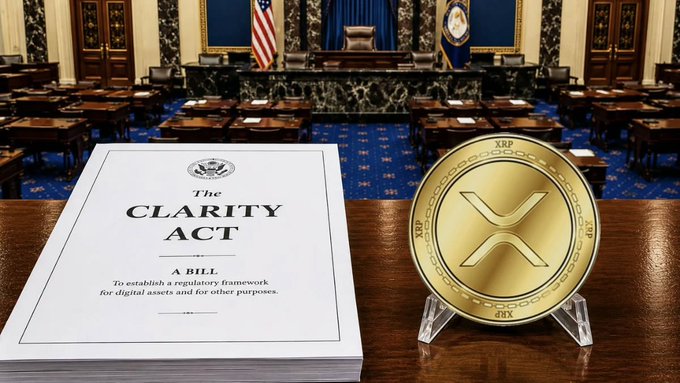 Image showing 'The CLARITY ACT' bill document alongside a gold XRP coin on what appears to be a congressional chamber desk, suggesting legislative context for XRP/cryptocurrency regulation.