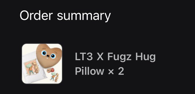 An order summary screen showing a purchase of an 'LT3 X Fugz Hug Pillow × 2', featuring a heart-shaped character with eyes alongside a t-shirt and small accessories.