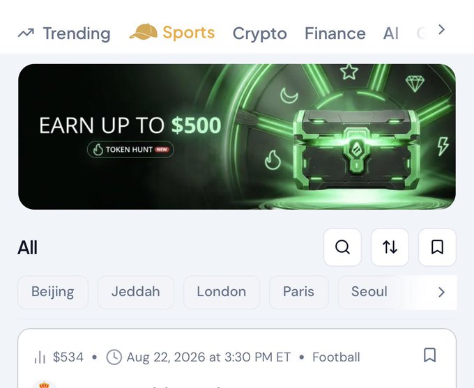 A sports prediction market platform homepage displaying a featured "Token Hunt" promotion offering up to $500, with navigation tabs for Trending, Crypto, Finance, and AI, alongside city filters (Beijing, Jeddah, London, Paris, Seoul) and a live odds feed showing a football event priced at $534 on August 22, 2026.