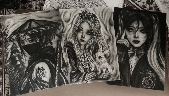 A collection of black and white artistic prints or drawings features various stylized character portraits, including a masked figure with a parasol, a girl with a skull crown holding a small creature, and a woman with detailed facial features.