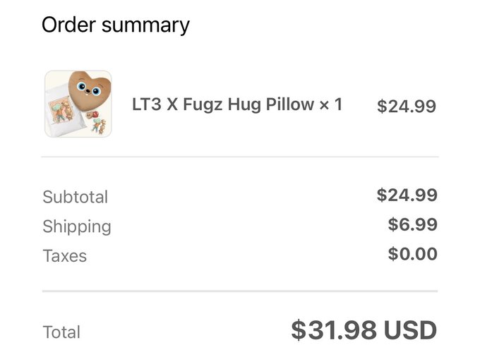 An order summary showing an 'LT3 X Fugz Hug Pillow' for $24.99, with $6.99 shipping, $0.00 taxes, totaling $31.98 USD.