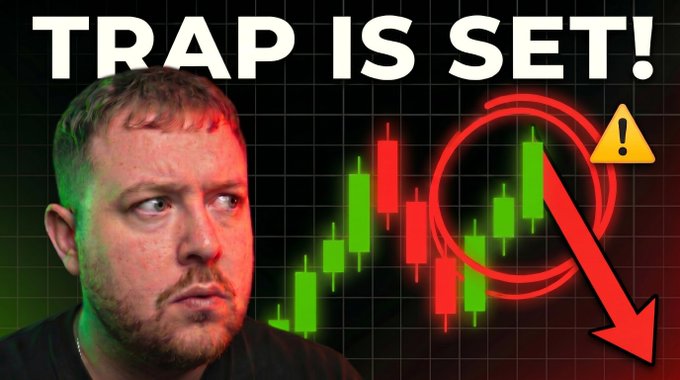 !!!This image features a man with a frowning face, who appears to be deep in thought or contemplating something. The text at the top of the image reads "TRAP IS SET!: I AM SHAKING WITH FEAR!!!!! Comment on the video to win $100 See Why I'm Scared :::" and there is a downward arrow pointing to a stock chart below. It seems that someone has left negative feedback or comments about the content they have seen in this video, suggesting dissatisfaction with its message or advice.