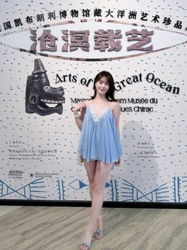 A young woman in a light blue dress poses in front of a "Arts of Great Ocean" exhibition backdrop featuring text in Chinese, French, and English at the MUCEM museum. The image ties to the post's narrative of trading $CXMT and $HYPE tokens, with her museum visit framed as a leisurely break from crypto trading activities.