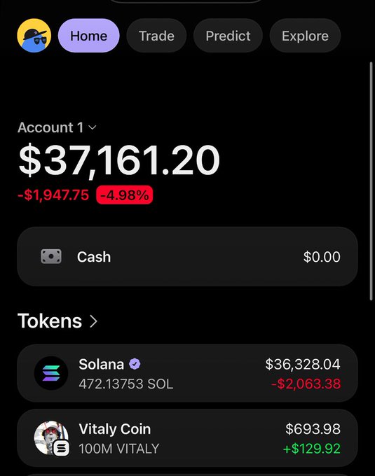 A mobile crypto portfolio screen displays Account 1 with a balance of $37,161.20, down $1,947.75 (-4.98%), holding 472.13753 SOL (Solana) valued at $36,328.04 and 100M Vitaly Coin (VITALY) worth $693.98, referencing the Solana contract address 89iAFAm6Mxse4bBqKDuua9BmViinqSNbhat63XGfKq4f used to identify the VITALY token on the Solana blockchain.