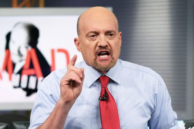 A bald man in a light blue shirt and red tie speaking animatedly on a TV show set, with a 'MAD MONEY' logo visible in the blurred background.