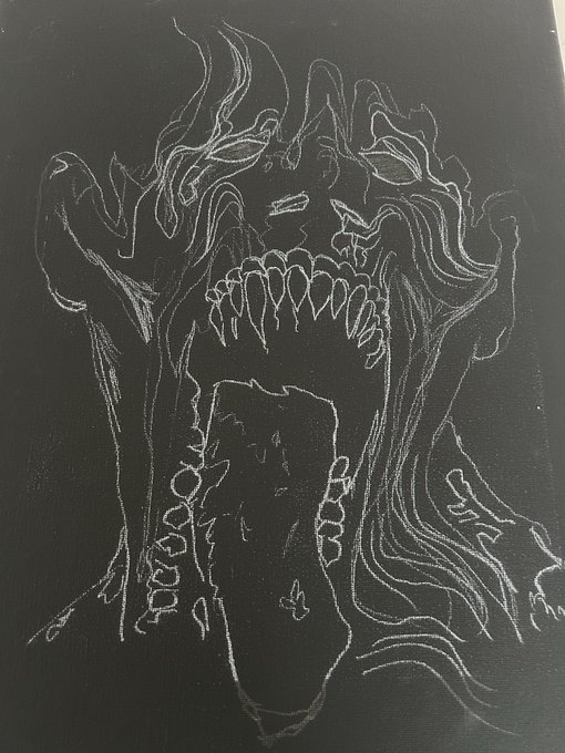 A white-on-black sketch depicting a menacing, monstrous face with flowing hair, sharp teeth, and an open, screaming mouth.