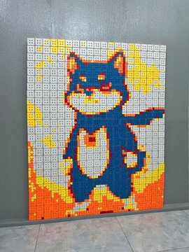 A mosaic artwork of a blue Shiba Inu dog created from 500 Rubik's Cubes, displayed against a white wall, representing the "MAME INU" cryptocurrency project on the BNB Chain. The pixelated design features the dog with fiery orange and yellow background flames, matching the post's theme of a bold artistic statement for the meme coin culture.