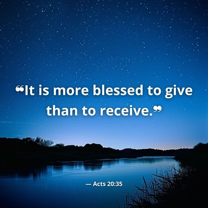 An inspirational graphic featuring the Bible verse Acts 20:35 "It is more blessed to give than to receive" displayed over a starry night sky and lake.