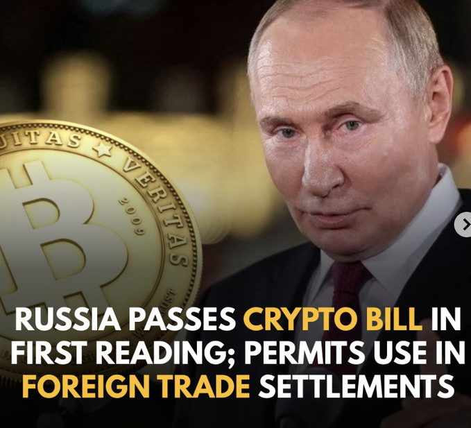 The image shows a Bitcoin coin alongside Vladimir Putin, with text stating "RUSSIA PASSES CRYPTO BILL IN FIRST READING; PERMITS USE IN FOREIGN TRADE SETTLEMENTS." This visually represents Russia's recent legislative move towards cryptocurrency regulation.