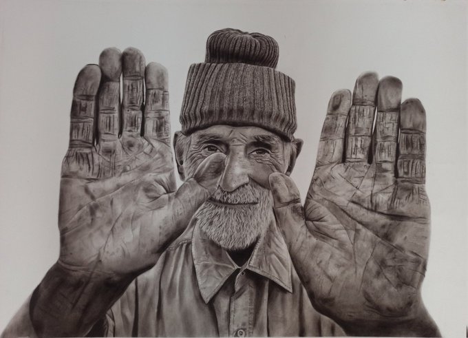 A highly detailed black and white pencil drawing shows an elderly bearded man wearing a knit beanie, holding up both of his heavily textured, weathered hands toward the viewer.