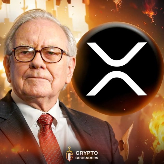 The image features an older man wearing glasses, a suit, and a red tie standing next to a large circle with the XRP symbol inside of it. The caption below the image reads "BOOOOOOOMMMM!!! Warren Buffett says it might be a good idea ... own a lot of other currencies". This suggests that the post is promoting investing in cryptocurrencies like Bitcoin or XRP, as suggested by the man's statement about owning multiple currencies.