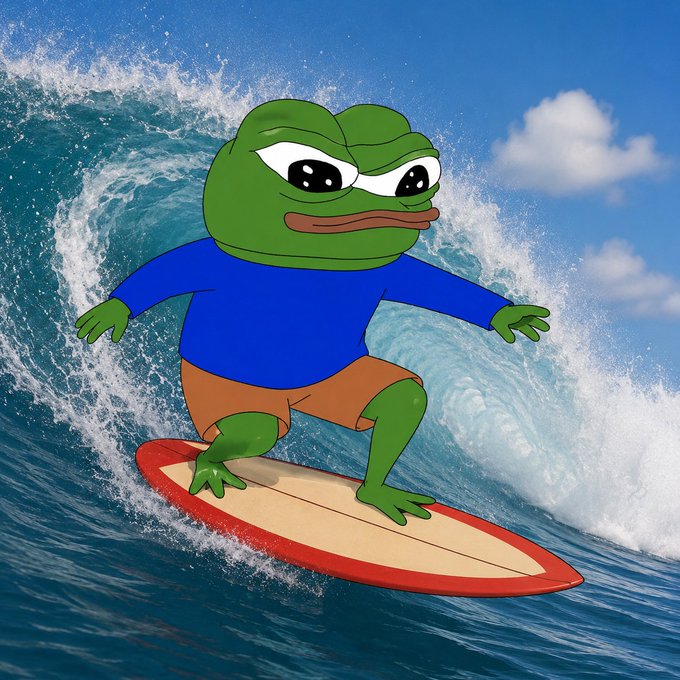 Cartoon illustration of a green frog wearing a blue shirt and orange shorts, surfing on a red and white surfboard across a large ocean wave under a blue sky.