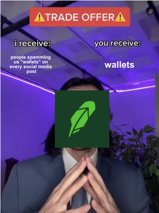 A meme-style 'TRADE OFFER' image featuring a person in a suit with a feather icon over their face, where 'i receive: people spamming us "wallets" on every social post' and 'you receive: wallets'.
