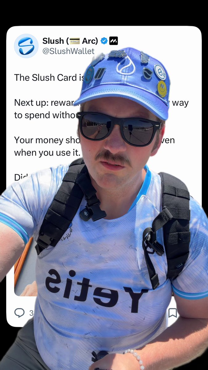 The image features a man wearing sunglasses, a blue cap with a white logo, and a backpack. He appears to be posing for a picture or sharing his thoughts about something related to Slush wallet. The caption of the image reads "Can someone please clarify" which suggests that there might be confusion or uncertainty regarding the content of the post.
