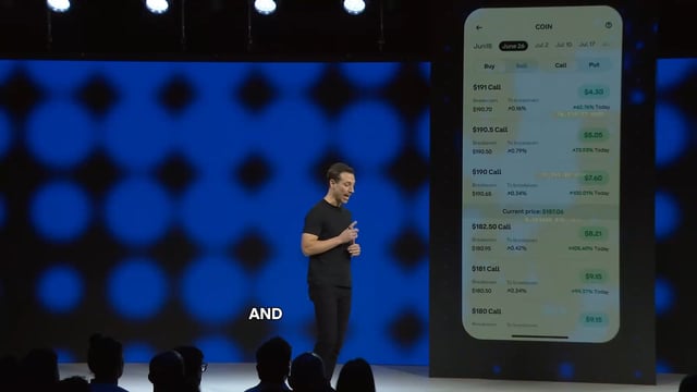 In the image, a man wearing a black shirt is standing behind a podium with an Apple iPhone displaying information about tradeable stocks or exchanges. A crowd of people is gathered around him, indicating that he might be addressing a large audience or giving a presentation on investing in stock market platforms like Coinbase. The post suggests that there are tradeable stock indexes and 24/7 trading services available for users to access at any time.