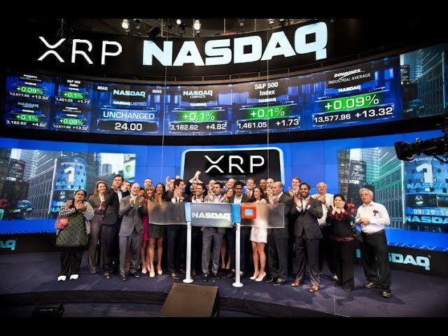A group of people gather on stage at the NASDAQ under large screens displaying "XRP NASDAQ" branding and market indices including the S&P 500 (+0.1%) and Industrial Average (+0.09%), celebrating an XRP-related milestone. The central podium and "XRP" logo, along with the NASDAQ ticker visible on screens, visually reinforce the post's claim about XRP's historic listing on the exchange.
