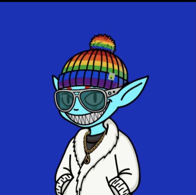 A cartoon character with blue skin, pointed ears, sharp teeth, and a rainbow beanie, wearing sunglasses, a gold chain, and a white robe against a blue background.