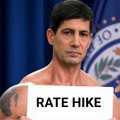 A man with dark hair stands in front of a seal that appears to read "DEPARTMENT OF JUS" (likely the Department of Justice or similar government seal). He holds a white sign with bold black text reading "RATE HIKE," visually reinforcing the post about Fed Chair Kevin Warsh's statement that today's rate hike was the Fed's own decision rather than the market's.