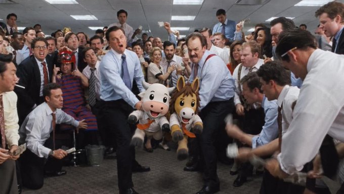 A chaotic scene of a crowded office where two men are fighting over two stuffed mascots—one a cow and one a horse—referencing the famous newspaper fight from 'Anchorman'.