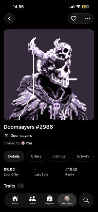 The image shows a screenshot of an NFT listing for "Doomsayers #2986" priced at $6.92 with a rarity of #1939, displaying a pixel-art skull character in dark purple tones. The collection is marked as "Owned by You," indicating the user received this spooky Doomsayer NFT as a gift, matching the post's mention of unexpectedly receiving it from @DoomsayersNFT.