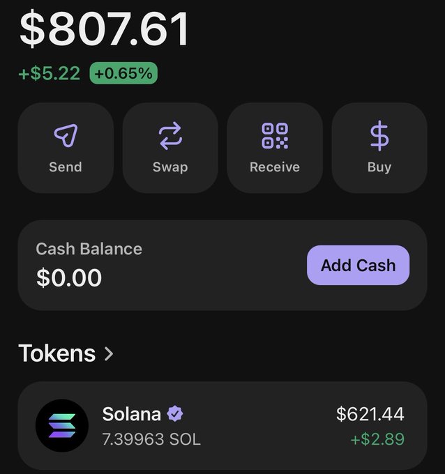 The image shows a cell phone screen displaying information about trading tokens, specifically Solana tokens. There are several options available for trading these tokens, including buying, selling, and adding cash balances. The screen also displays the current value of the tokens, which is $21.44.