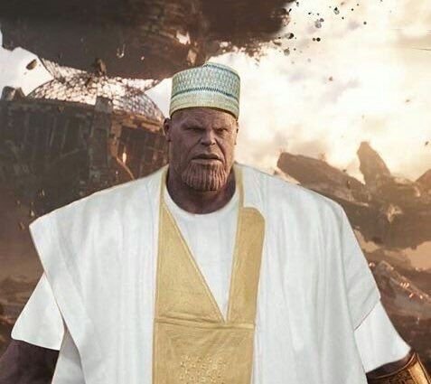 A Thanos character edited to wear a white robe and Muslim kufi cap stands before a destroyed battlefield background. The image parodies the classic "Gm lads" (good morning) crypto trading greeting by replacing the typical jolly or stoic meme figure with a menacing galactic warlord, humorously contrasting the friendly greeting with an apocalyptic scene.