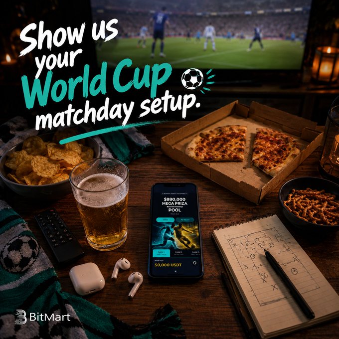 The image shows a table with various items related to a World Cup setup. There are two pizzas placed on the table, one near the center and another towards the right side of the table. A cell phone is also present on the table, along with a remote control and a book. The text in the image encourages viewers to share their World Cup setups by liking or sharing the post, which could potentially lead to receiving a 10-USDT Futures Voucher from BitMart as a reward for participating.