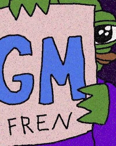 A cartoon-style image of a green character holding a sign that reads 'GM FREEV'.
