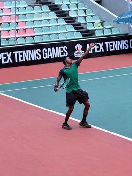 A young boy in a green shirt and black shorts practices his tennis swing on a court featuring "APEX TENNIS GAMES" signage on the barriers behind him, visually reinforcing the post's praise for the Apex Network community's consistent growth and commitment to building over six years.