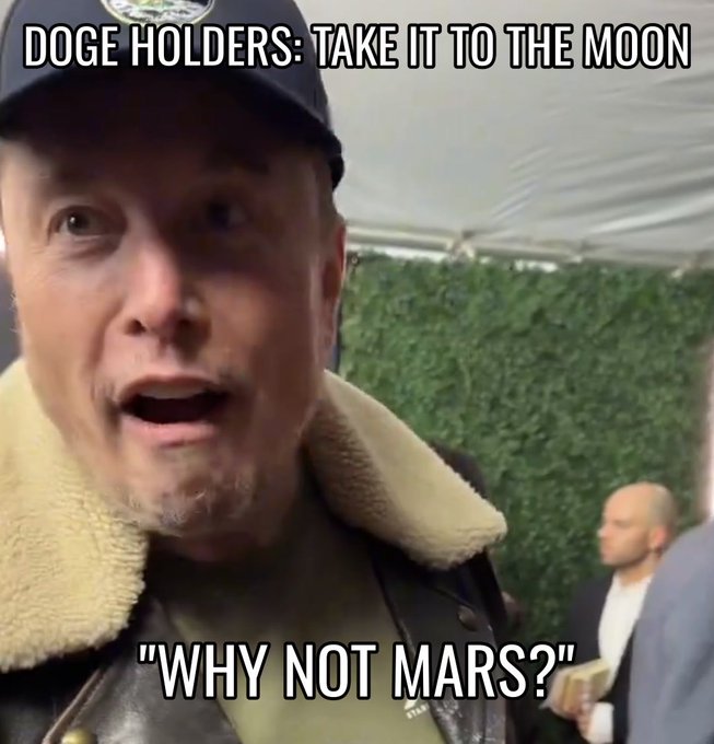 A meme featuring Elon Musk wearing a black cap and a shearling-lined leather jacket. The text reads 'DOGE HOLDERS: TAKE IT TO THE MOON' at the top and '"WHY NOT MARS?"' at the bottom.