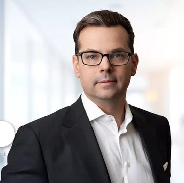 Portrait of Noel Kimmel, President of Ripple Prime, wearing glasses and a dark suit. The post announces Ripple’s $275 million senior debt issuance to expand Ripple Prime’s prime brokerage business.