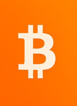 A simple Bitcoin logo featuring the iconic white "₿" symbol centered on a bright orange background.