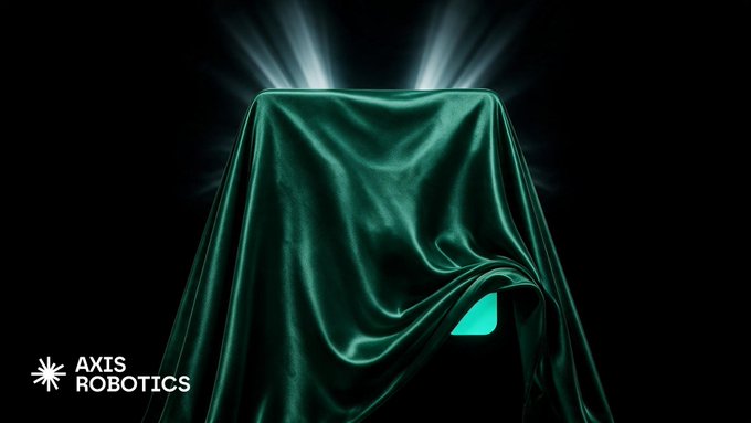A promotional image for Axis Robotics featuring a green velvet cloth covering an object, with dramatic light rays emanating from behind it and the company logo in the bottom left corner.