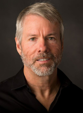 A headshot of Michael Saylor, who discusses an ambitious plan to accumulate $70 billion in Bitcoin and predicts a price of $10 million, reflecting a highly bullish outlook.
