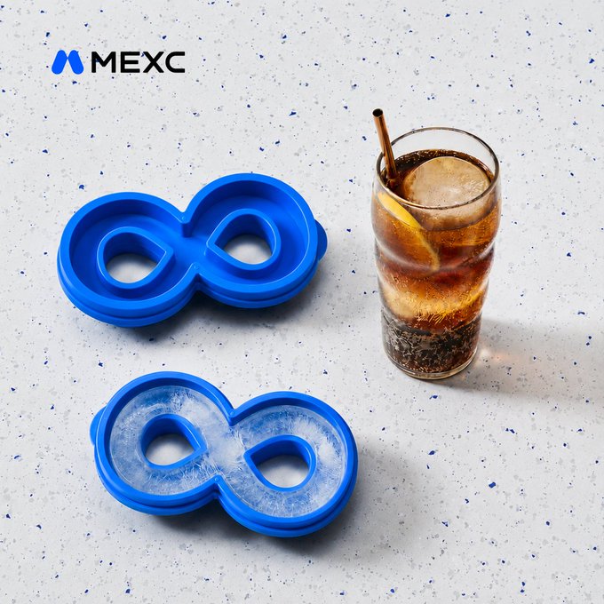 Two blue figure-eight ice molds sit on a speckled white surface—one empty and one filled with ice—next to a glass of cola and a lemon slice, branded with the "MEXC" logo, illustrating the "prepare for summer the #MEXC way" message with themed novelty ice cubes.