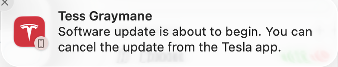 A Tesla app notification from the vehicle 'Tess Graymane' stating: 'Software update is about to begin. You can cancel the update from the Tesla app.'