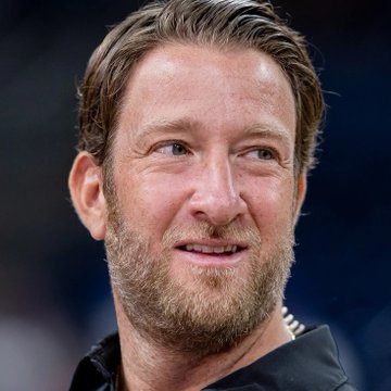 A close-up of Dave Portnoy smiling, illustrating the post about his public commitment to hold Bitcoin despite potential losses, reinforcing the message about conviction being tested during market downturns.