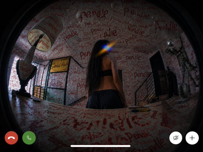 A screenshot of a video call shows a woman with long hair standing in a "Pendle"-branded room, with the recurring text "Pendle" covering the walls, floor, and decor in red lettering, fitting the post's update about Pendle news including the new auto-looping feature, CEO talk summary, and 76% emissions cut.