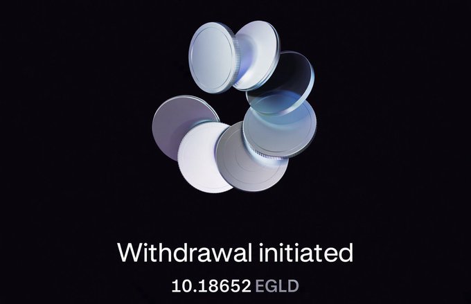 A digital graphic displaying 3D coins floating above the text 'Withdrawal initiated' and '10.18652 EGLD' on a dark background.