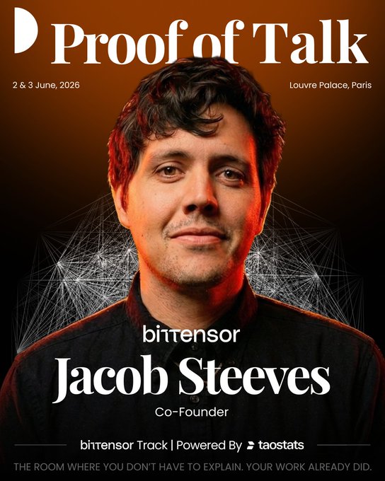 The image features a man with short hair, wearing a black shirt, standing against an orange background. The text "proof of talk" is written above him, indicating that he is featured in a magazine article or poster related to "proof of talk". The main focus of the image is on the man's face and his attire, which are both prominently displayed.