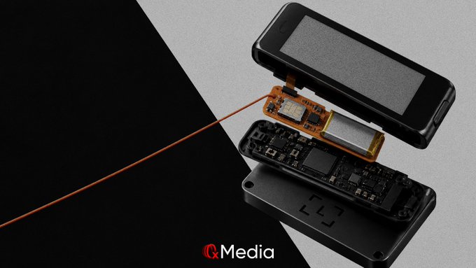 A technical exploded view of an iQ Media device showing the internal components including the screen, circuit board, and battery layers of a compact electronic device.